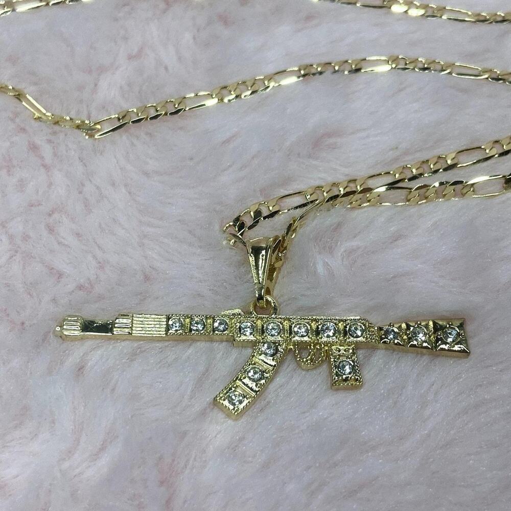 Gold plated necklace with gun